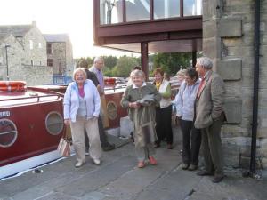 Members and wives disembarking from the canal boat
